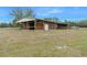 Rustic barn with covered stalls and open space at 4148 Batten Rd, Brooksville, FL 34602
