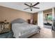 Main bedroom with a king-size bed and sliding glass door at 4148 Batten Rd, Brooksville, FL 34602
