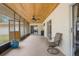 Relaxing screened porch with ceiling fan and access to yard at 4148 Batten Rd, Brooksville, FL 34602