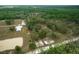 Aerial view of property with multiple structures and fenced pastures at 4148 Batten Rd, Brooksville, FL 34602