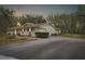Ranch-style home with brick facade, attached garage, and picnic table at 4148 Batten Rd, Brooksville, FL 34602