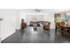 Comfortable living room with sectional sofa and tile floors at 4148 Batten Rd, Brooksville, FL 34602