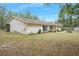 Ranch-style home with a covered porch and large yard at 4148 Batten Rd, Brooksville, FL 34602