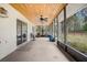 Spacious screened porch with ceiling fan and wooded views at 4148 Batten Rd, Brooksville, FL 34602