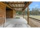 Spacious barn with covered walkway, stalls, and fenced pastures at 4148 Batten Rd, Brooksville, FL 34602