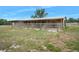 Long barn with several stalls and a fenced pasture at 4148 Batten Rd, Brooksville, FL 34602