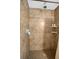 Large tiled shower with built-in shelves at 4148 Batten Rd, Brooksville, FL 34602