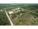 Aerial view of a rural property with a house, barn, and pastures at 4148 Batten Rd, Brooksville, FL 34602