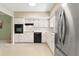 Classic kitchen with white cabinets, stainless steel appliances, and ample counter space at 2260 Costa Rican Dr # 24, Clearwater, FL 33763