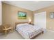 Light-filled bedroom, featuring a comfortable bed and plenty of closet space at 2260 Costa Rican Dr # 24, Clearwater, FL 33763
