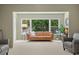 Living room featuring a tan couch and large windows offering abundant natural light at 2260 Costa Rican Dr # 24, Clearwater, FL 33763