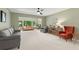 Spacious living room with light walls, large windows, and comfortable seating at 2260 Costa Rican Dr # 24, Clearwater, FL 33763