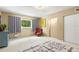 Light and airy bedroom featuring a comfortable bed and chair at 2260 Costa Rican Dr # 24, Clearwater, FL 33763