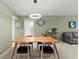 Bright dining room with wood table and chairs, and an open concept to the living area at 2260 Costa Rican Dr # 24, Clearwater, FL 33763