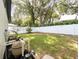 Landscaped backyard with a pool pump and filter system at 6005 Soaring Ave, Temple Terrace, FL 33617