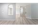 Bright hallway with vinyl flooring and archway detail at 6005 Soaring Ave, Temple Terrace, FL 33617