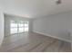 Spacious living area with vinyl flooring and pool views at 6005 Soaring Ave, Temple Terrace, FL 33617