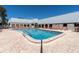 Community pool with plenty of lounge chairs at 11937 Bayonet Ln, New Port Richey, FL 34654