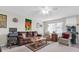 Cozy living room featuring a brown couch, comfy chairs, and a coffee table at 11937 Bayonet Ln, New Port Richey, FL 34654