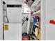 Stackable washer and dryer in a small laundry room with extra storage at 11937 Bayonet Ln, New Port Richey, FL 34654