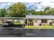 Exterior view of the house showing the carport and front entrance at 11937 Bayonet Ln, New Port Richey, FL 34654