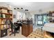 Multi-functional home office features built-in shelving, desk, and access to a screened porch at 11937 Bayonet Ln, New Port Richey, FL 34654