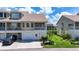 Two-story townhome with attached garage and manicured lawn at 8230 Brent St, Port Richey, FL 34668