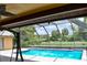 Inviting screened pool with a spacious backyard at 6336 Wooden St, New Port Richey, FL 34653