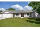 Ranch style home with a two car garage and well maintained lawn at 6336 Wooden St, New Port Richey, FL 34653