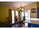 Bright dining room with a wood table and access to a screened porch at 6336 Wooden St, New Port Richey, FL 34653