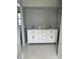 Bathroom with double vanity and marble countertops at 6336 Wooden St, New Port Richey, FL 34653
