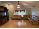 Spacious living room featuring hardwood floors and comfortable leather sofas at 6336 Wooden St, New Port Richey, FL 34653