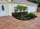Exterior view of the house's entrance with landscaping at 6075 Shingler Ave, Spring Hill, FL 34608