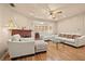 Cozy living room featuring a brick fireplace, hardwood floors, and comfortable seating at 1501 28Th N Ave, St Petersburg, FL 33704