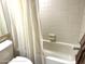 Bathroom with bathtub and shower curtain at 7278 Scotland Cir, Weeki Wachee, FL 34613