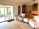 Living area with access to sunroom and comfortable seating at 7278 Scotland Cir, Weeki Wachee, FL 34613