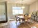 Dining area with wood table and chairs, hardwood flooring at 7278 Scotland Cir, Weeki Wachee, FL 34613