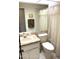 Bathroom with toilet, sink, and shower at 7278 Scotland Cir, Weeki Wachee, FL 34613