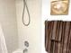 Bathroom with tub, shower, and tiled walls at 7278 Scotland Cir, Weeki Wachee, FL 34613
