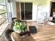 Relaxing sunroom featuring comfortable seating and access to backyard at 7278 Scotland Cir, Weeki Wachee, FL 34613