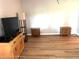 Living room featuring wood-look floors and simple decor at 7278 Scotland Cir, Weeki Wachee, FL 34613