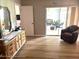 Bedroom with wood-look floors and access to a sunroom at 7278 Scotland Cir, Weeki Wachee, FL 34613