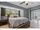 Main bedroom with a queen bed, and direct access to backyard at 9 Grace St, Crystal Beach, FL 34681