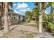 Landscaped side yard with brick pavers and walkway at 9 Grace St, Crystal Beach, FL 34681