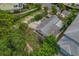 Bird's-eye view of a house, yard, and waterfront lot at 9 Grace St, Crystal Beach, FL 34681