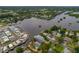Aerial view showcasing a waterfront property with surrounding homes and waterways at 9 Grace St, Crystal Beach, FL 34681