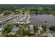 Aerial view of waterfront home with private dock and lush landscaping at 9 Grace St, Crystal Beach, FL 34681