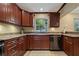 Updated kitchen with granite countertops and wood cabinets at 9 Grace St, Crystal Beach, FL 34681