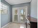 Bright laundry room with access to the backyard at 9 Grace St, Crystal Beach, FL 34681