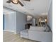 Spacious living room featuring a large sectional sofa and flat-screen TV at 9 Grace St, Crystal Beach, FL 34681